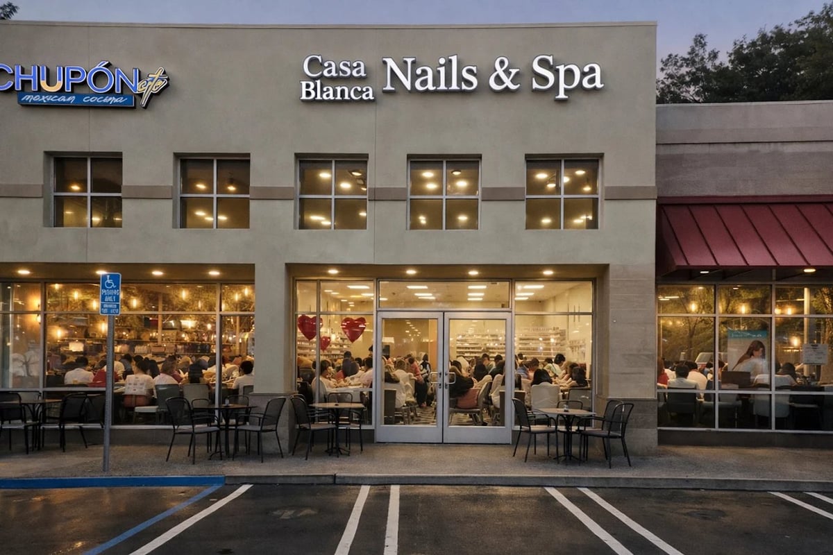 Exterior view of Casa Blanca Nails & Spa storefront with illuminated windows at dusk